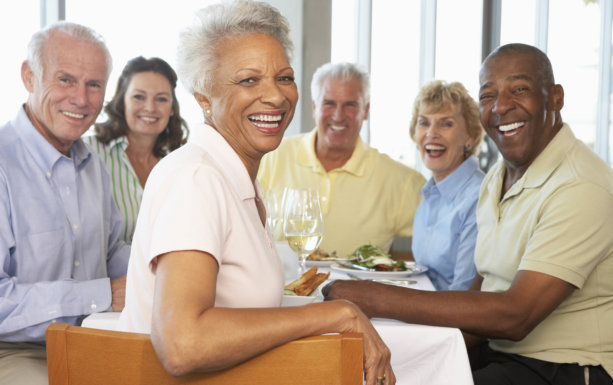 portrait of seniors smiling and eating