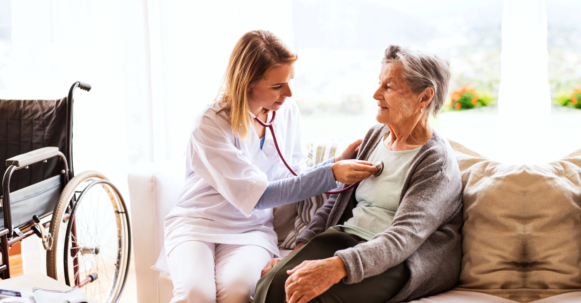 caregiver and senior woman sitting