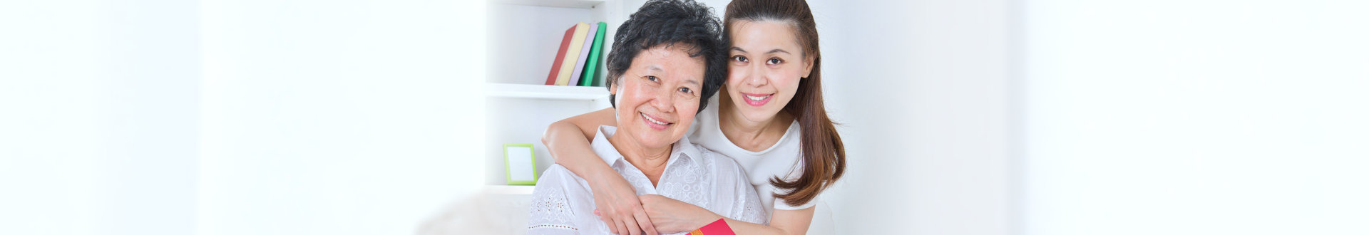 senior woman with daughter smiling