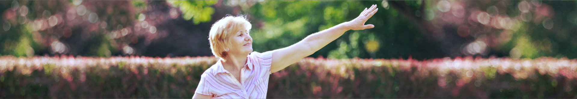 Graceful Old Woman in the Park Stretching her Hand