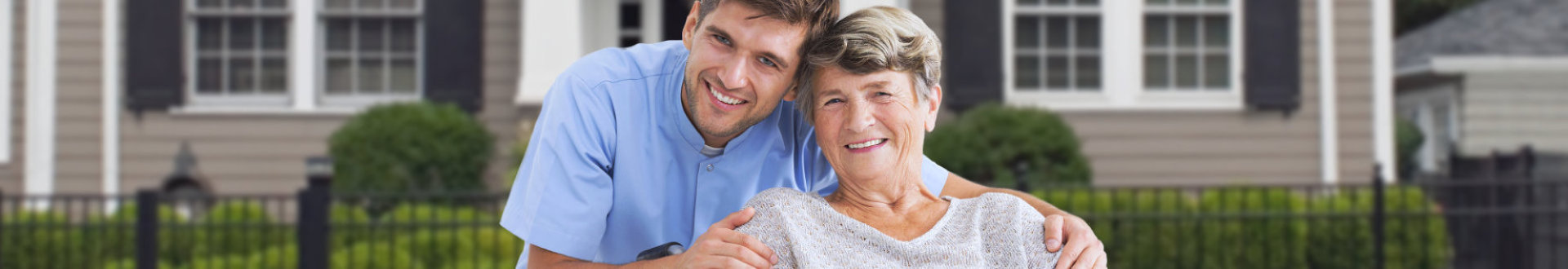 Male nurse hugging his senior woman patient